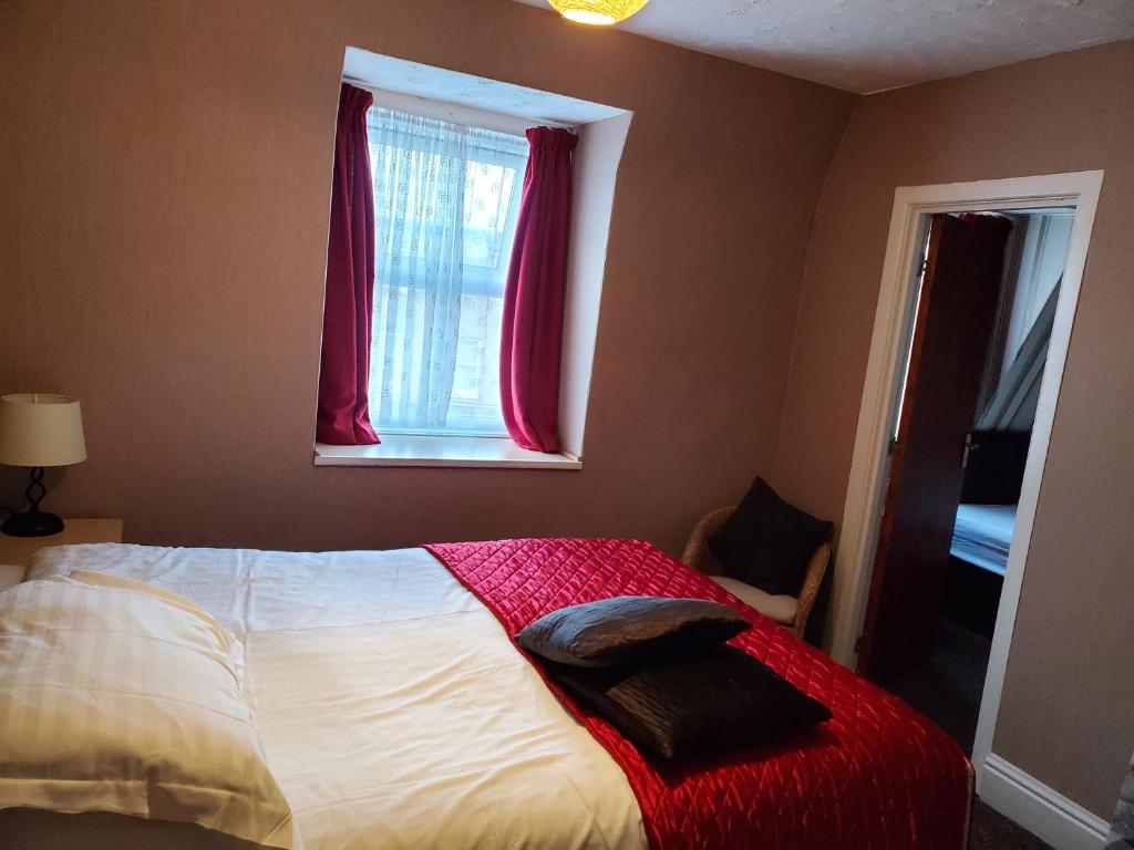 Family Room at The Cumbrian Hotel, Blackpool, with a double and a single bed